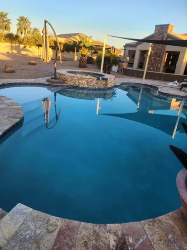Newly resurfaced pool with clear blue water